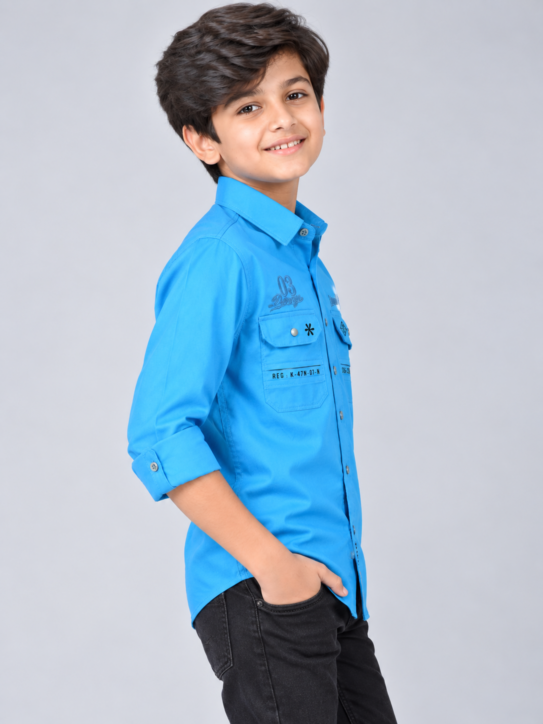 62ad6994-5a93-4399-8df1-1fa99030eb57 Boys Vibrant Blue Utility Shirt with Graphic Detailing - Image 1